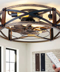 20 Inch Farmhouse Flush Mount Ceiling Fan With Lights And Remote shown with industrial black cage fandelier in a room setting.