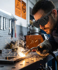 Man using Premium Heavy Duty Industrial Double Lens Welding Goggles Featuring Top Shelf Anti Glare Optics for welding sparks.