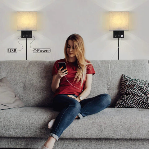 Woman using phone under Bedside Wall Lamp Set Of 2 Plug In Sconce Lights With USB Charging Ports And AC Outlet Brushed Nickel