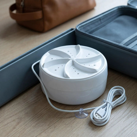 Hella Compact Turbo Portable Washer For Clothes And Socks Ditch The Laundromat Stress Rad Mini turbine with power cord, compact design.