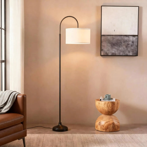 Nora Arc LED Tall Floor Lamp With Heavy Base For Living Room And Office, Sleek Mid Century Modern Black Standing Lamp beside chair