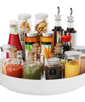 Hella Rugged 13 Inch Metal Lazy Susan Turntable For Kitchen Cabinet And Pantry Rack Storage White with various spices and condiments
