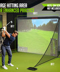 Man practicing with 10x7ft Golf Simulator Enclosure Net With Side Barriers, Low Noise Silk Target in indoor setting.