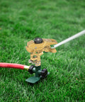 Heavy Duty Rock Solid Half Inch Zinc Impact Sprinkler 2 Pack Adjustable Zero To Three Sixty Degree Lawn Sprinkler Head with nozzles spraying water.
