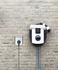 Heavy Duty EV Charging Station Rain Cover For Outdoor Wall Units Weatherproof Roof mounted above charger on brick wall.