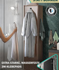 Top Shelf Black Self Adhesive Towel Hooks 6 Pack Stainless Steel Bathroom Wall Mount holding towels in a humid setting.