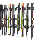 Modern Top Shelf Heavy Duty Wall Mount Ski Rack Solid Garage Game Changer To Securely Hold 16 Pairs Of Long And Short Alpine Skis Plus Snowboards With Hook Clamps mounted with multiple skis.