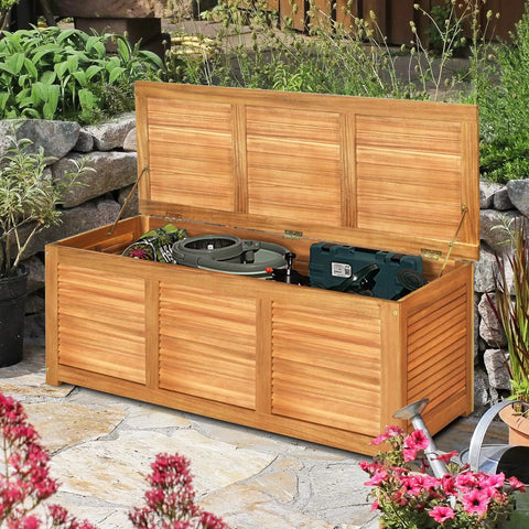 Acacia Wood Deck Box Bench 47 Gallon Outdoor Storage Chest with seating, open lid showing tools, natural finish in garden
