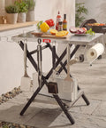 Foldable Outdoor Grill Table And Prep Station With Pizza Oven Base And Griddle Stand, showing table with cooking tools