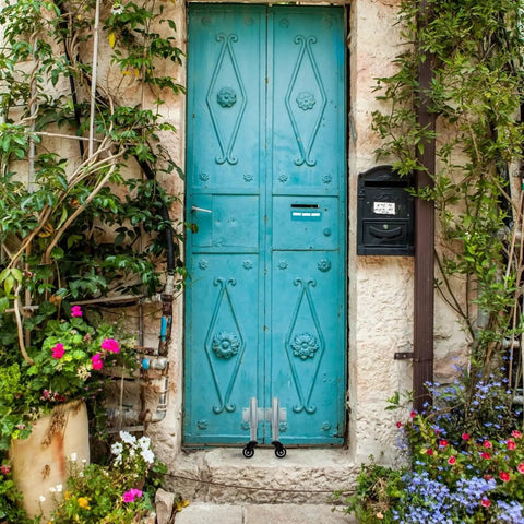 Premium 2 Inch Polyurethane Spring Loaded Gate Wheel For Heavy Duty Wooden Outside Gates With Swivel Design Smooth Rolling Action Built Badass Metal Assembly No Fuss Ready To Roll Installation on turquoise door.