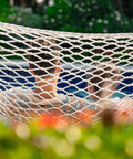 Two Person 12 Ft Double Rope Hammock With Spreader Bar Hand Woven Cotton Outdoor Patio Hammock For Poolside Lounging Fits 13 To 15 Ft Stand Supports Up To 450 Lbs Natural Color 141 X 57 Inches with two people relaxing in it.