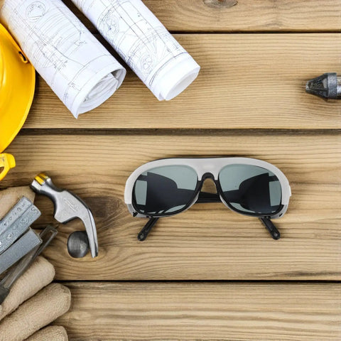 Kickass Protective Eyewear And Safety Glasses With Lenses For Welders Lightweight Adjustable Fit Anti Scratch 10 Piece Pack on wooden surface with tools.
