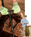 Person using Heavy Duty Compost Stirring Tool 33.4 Inch Turning Bar For Outdoor Compost Tumbler Bins Manual Aerator in garden.