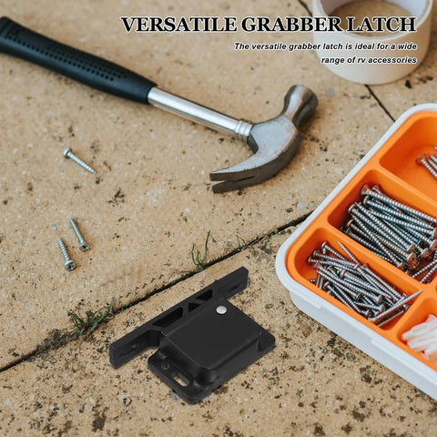 RV Cabinet Latches Two Pack With Spring Hook Lock and screws on concrete surface with hammer and toolbox nearby