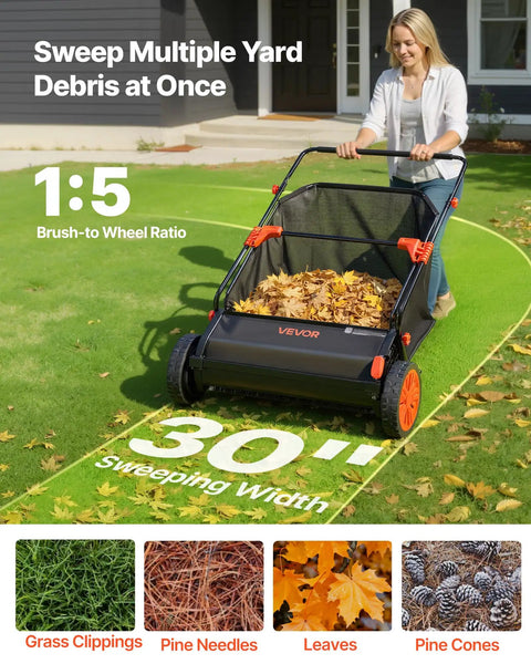 Heavy Duty Push Lawn Sweeper With 30 Inch Wide Broom And 12 Cubic Foot Hopper Bag For No Sweat Grass And Leaf Pickup Across Big Lawns Patios Sidewalks And Driveways, user sweeping leaves on grass.