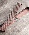 Rock Solid Stainless Steel Rectangle Floor Drain Cover With Removable Grate And Slick Hair Catcher For Bathroom Shower Tile Quick Drainage on wooden floor.