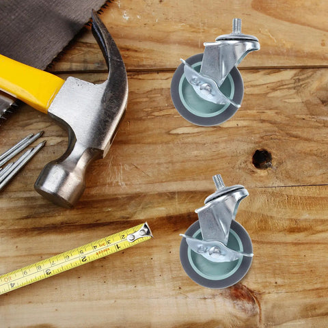 Four Pack Threaded Stem Swivel Caster Wheels With Rock Solid Lockable Brakes For Super Smooth Gliding Action on a wooden surface with tools.