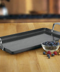 GreenGourmet Hard Anodized Nonstick Double Burner Griddle on kitchen table with eggs and berries