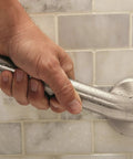 Person gripping Heavy Duty 18 Inch Bathroom Grab Bar With Concealed Screw Mounting And Mirror Polish Stainless Steel Finish