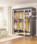 Straight Up Heavy Duty Rolling Clothes Rack With Removable Dust Cover Portable Closet Featuring Four Hanging Zones Adjustable Shelf And Smooth Gliding Wheels For Zero Hassle Storage in a room filled with various garments.