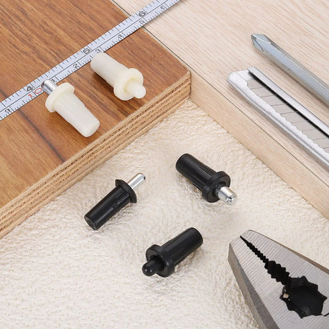 Heavy Duty Plantation Shutter Repair Pins, Spring Loaded Metal Pins For Louvers Windows, 100 Pack White, anti-slip grip pieces arranged on wood.