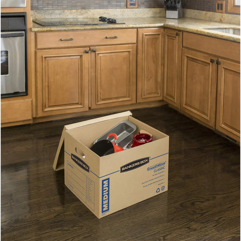 Solid Gear Medium Moving Boxes 20 Pack With Tapeless Assembly And Reinforced Carry Handles To Help You Haul Your Stuff Smoothly And Kick The Packing Hassle Right Out While Keeping Things Tight And Secure During Any Big Move, filled with kitchen supplies in a home kitchen.