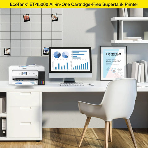 EcoTank Wireless Color All In One Printer With Scanner And Copier, Fax, Ethernet, Supertank System, Printing Up To 13 By 19 Inches, White Ideal For Home Office And Small Business Use on a desk with computer screen and chair