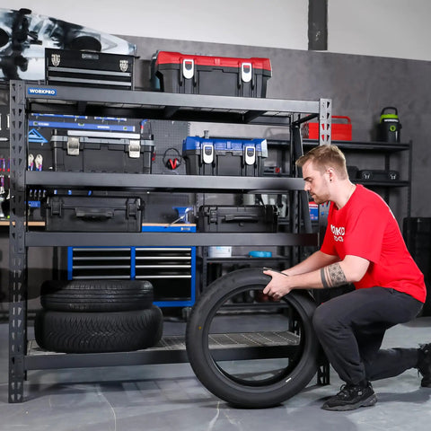 Person organizing tires on a Straight Up Massive Garage Shelving Unit With An Actual 8000 LBS Weight Limit And Extra Wide Adjustable Four Tier Steel Racks.
