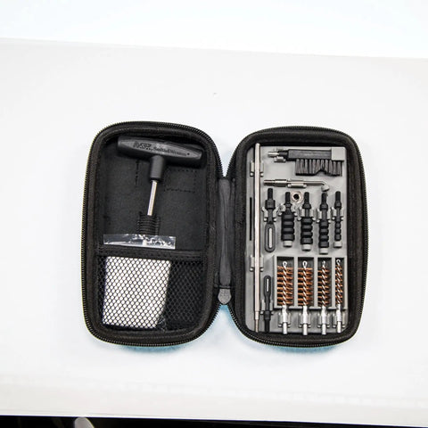 Ultra Compact Pistol Cleaning Kit For Handguns Built Tough For Range Rat Life with brushes in a zippered case.