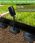 No Dig Garden Edging Kit 2 Inch Tall 20 Foot Border With 20 Stakes Plastic Lawn Edging being installed with a mallet