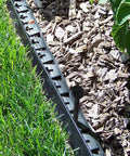 Spiral Landscape Anchoring Spikes 8 Inch Set For Lawn Edging installed along lawn and mulch border.