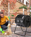 Woman using Dual Chamber Rotating Compost Tumbler No-Fuss Spin For Continuous Cycle Composting, 42 Gallon Large Capacity Outdoor Bin next to garden