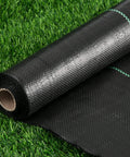 Heavy Duty Weed Barrier Landscape Fabric 2.6 Ft By 100 Ft Thick Garden Blocker Cloth roll on grass, woven geotextile material visible.