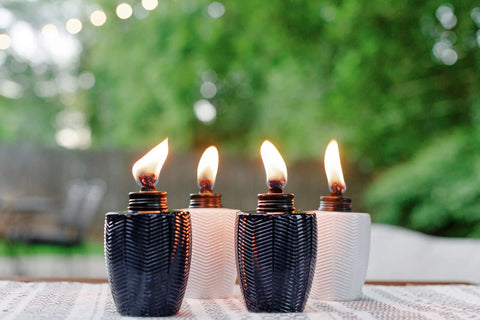 Glass Table Torch Set For Outdoor Patio Vibe, Herringbone Blue 3-Pack, decorative torches lit on a patio table, weather resistant
