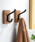 Rustic Wood Adhesive Wall Hooks Four Pack Heavy Duty Sticker Hangers Fits Coats Towels And Bags smooth design holding a towel.
