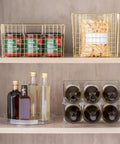 Slick Rotating Lazy Susan Turntable Spinner Fully Swiveling 11.5 Inch Clear Plastic Round Organizer with pantry items in storage.