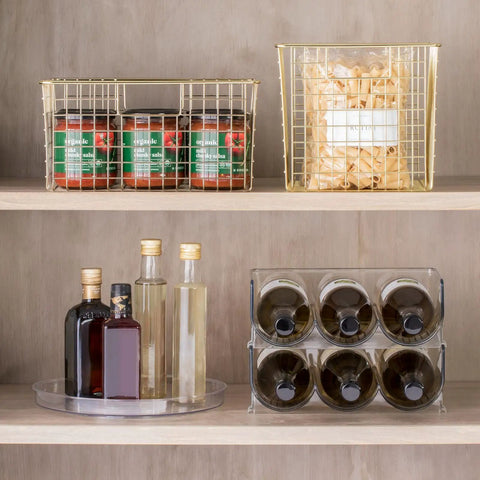 Slick Rotating Lazy Susan Turntable Spinner Fully Swiveling 11.5 Inch Clear Plastic Round Organizer with pantry items in storage.