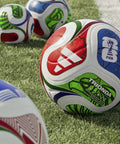 FIFA World Cup 26 Trionda Soccer Ball Size 4 With Hella Smooth Seamless TSBE Surface And Butyl Bladder For Superior Shape Retention And Dope Pro League Match Ready In White Royal Blue on grass.