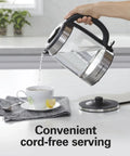 Electric Tea Kettle With 1500 Watts For Fast Boil 1.8 Liter Water Boiler Cordless Serving shown pouring hot water into a cup