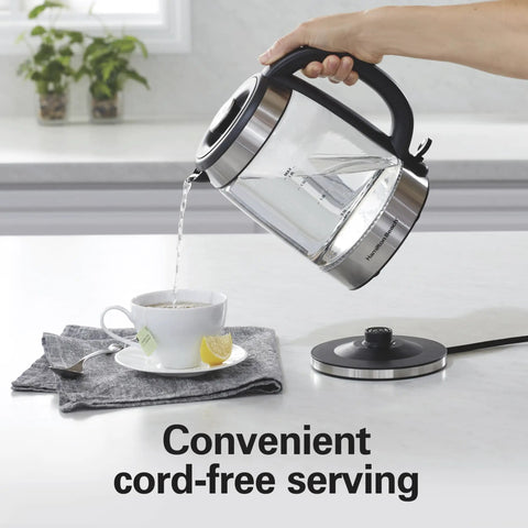 Electric Tea Kettle With 1500 Watts For Fast Boil 1.8 Liter Water Boiler Cordless Serving shown pouring hot water into a cup