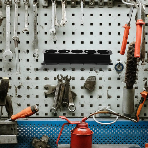 Heavy Duty Wall Mounted Spray Can Storage Rack And Metal Power Tool Organizer featuring a sleek design, holding tools against a pegboard.