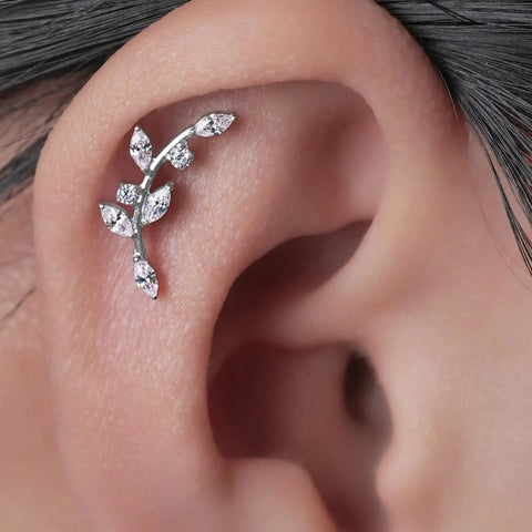 Implant Grade Titanium Screw Back Studs For Sensitive Ears Built Tough And Looking Sick With Zero Allergies Making Them A Straight Up Game Changer For Daily Grind on earlobe with a floral design.