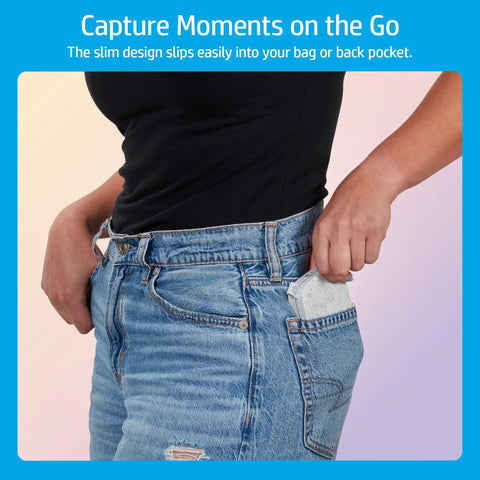 Person placing Pocket Sized Photo Printer For Instant Two By Three Inch Sticky Back Photos From Your Phone On The Go Luna Pearl Edition into back pocket.