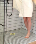 Rock Solid Gold Snap In Shower Drain Cover For Four Quarter Inch Round Stainless Steel Strainer in modern shower.
