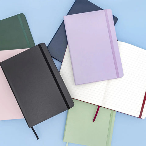 Top Shelf Hardcover Lined Journal Notebook With College Ruled Pages For Your Daily Grind And Heavy Note Taking laid flat with colorful covers