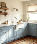 Rock Solid Brushed Gold Cabinet Knobs for Kitchen Drawers and Furniture, 1-1/4 Inch Round Hardware on blue cabinetry.