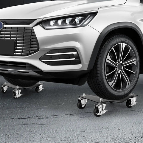 Heavy Duty Car Dolly Set Of 4 Rock Solid Steel Build With Dead Simple Locking Casters And 10000 Lbs Capacity under car tire on garage floor.