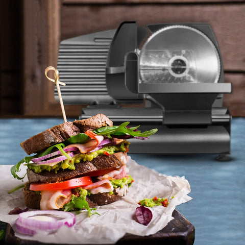 Powerhouse Electric Deli Slicer With Adjustable Thickness Dial And Precision Stainless Steel Blade for slicing sandwich ingredients.