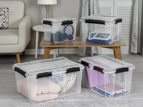 Built To Last Clear Storage Bins 54 Quart 2 Pack, Stackable Plastic Totes With Tight Lids, Gasket Sealed Waterproof Containers on a table.