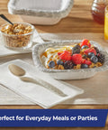 Eco Friendly Compostable Spoons For BBQs Parties And Camping 24 Count Durable Disposable Cutlery on napkin beside fruit bowl
